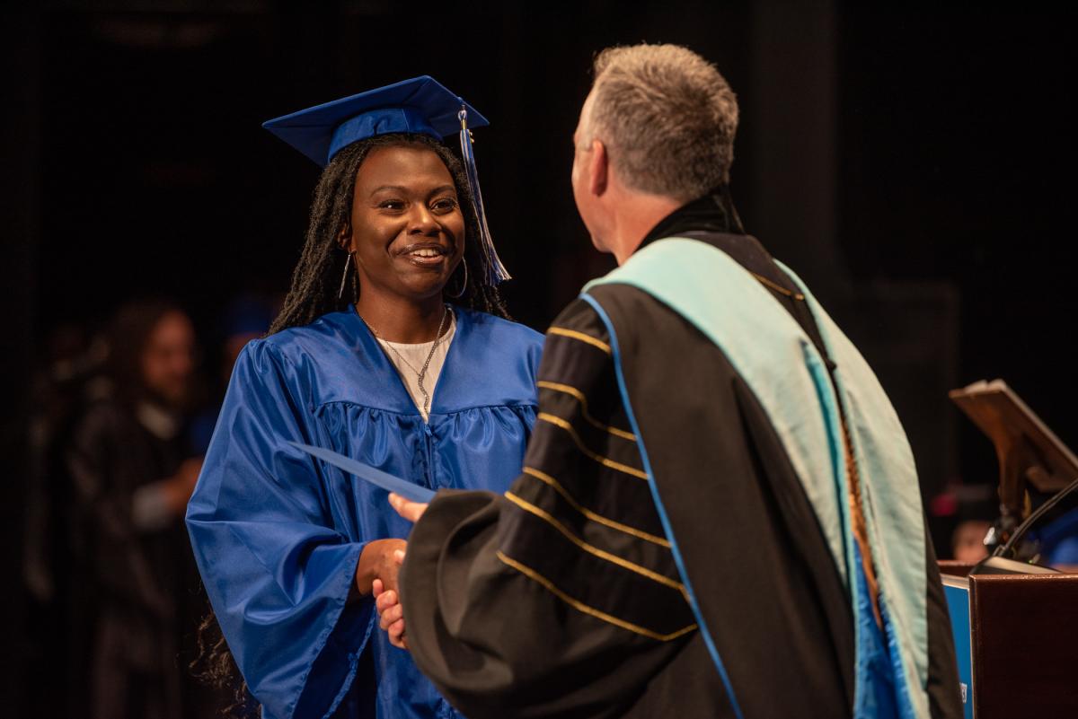 The day's import is reflected in the satisfied smile of Jashonda Scott, who graduated with an associate degree in human services & restorative justice.