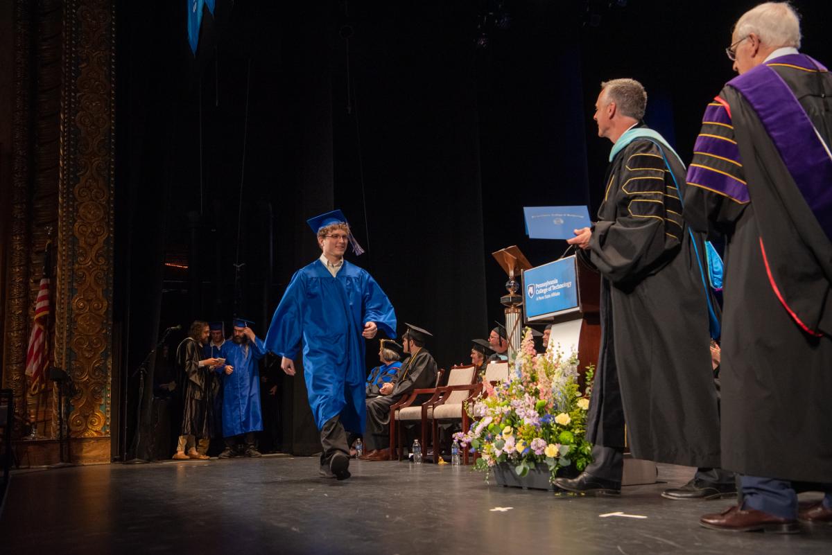 Among the day's IT grads is Trent Statts, eager to get to work in network & user support.