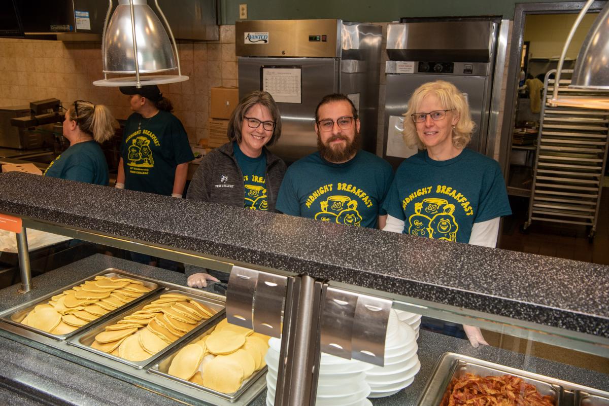 The "deans of the diner" work their short-order magic. From left are Jennifer McLean, dean of students; Anthony J. Pace, dean of enrollment and academic operations; and Joanna K. Flynn, dean of curriculum and instruction.