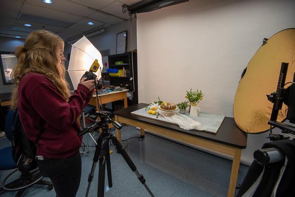 ... and a SUN Tech student tries her hand at photographing a lemony display (complete with a cake baked by Yoder).