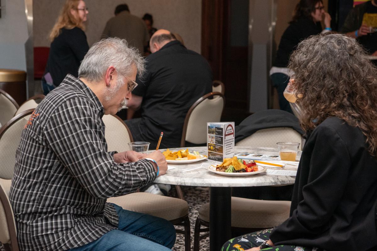 Among the major’s supporters, Dick L. LaCerra, supervisor of shipping and receiving services at Penn College, assesses the beverages.