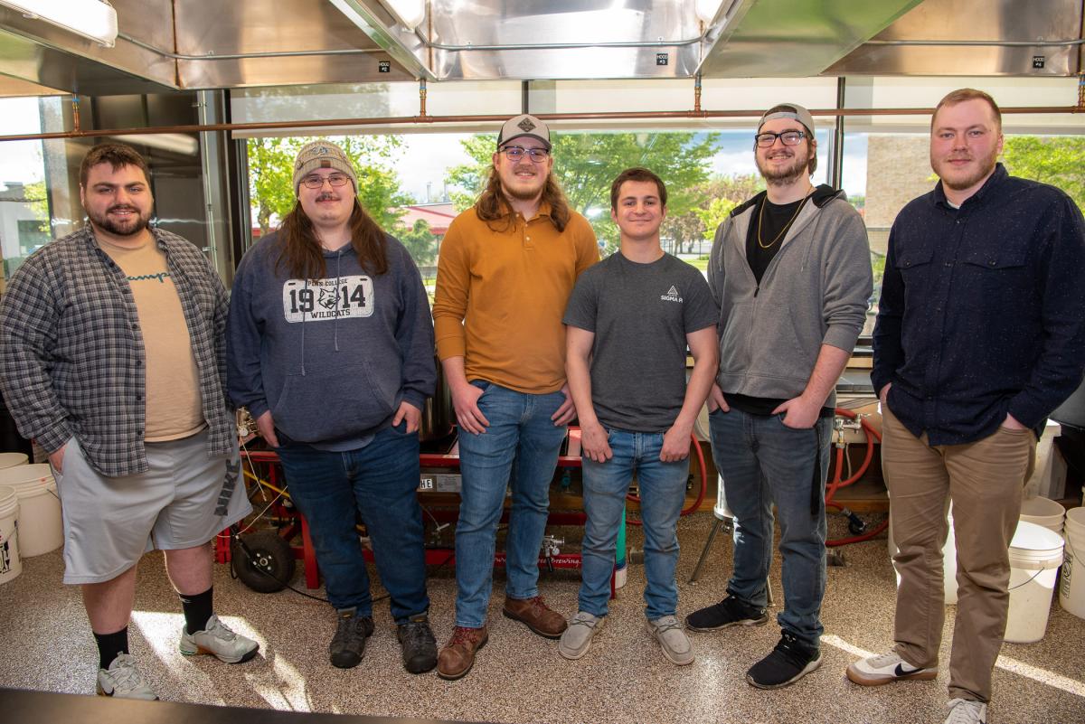 The brewing Class of 2023 (from left): Smith, Gilbert, Walton, Druckenmiller, Palchak and Ligon stand in their lab, ready for technical presentations.