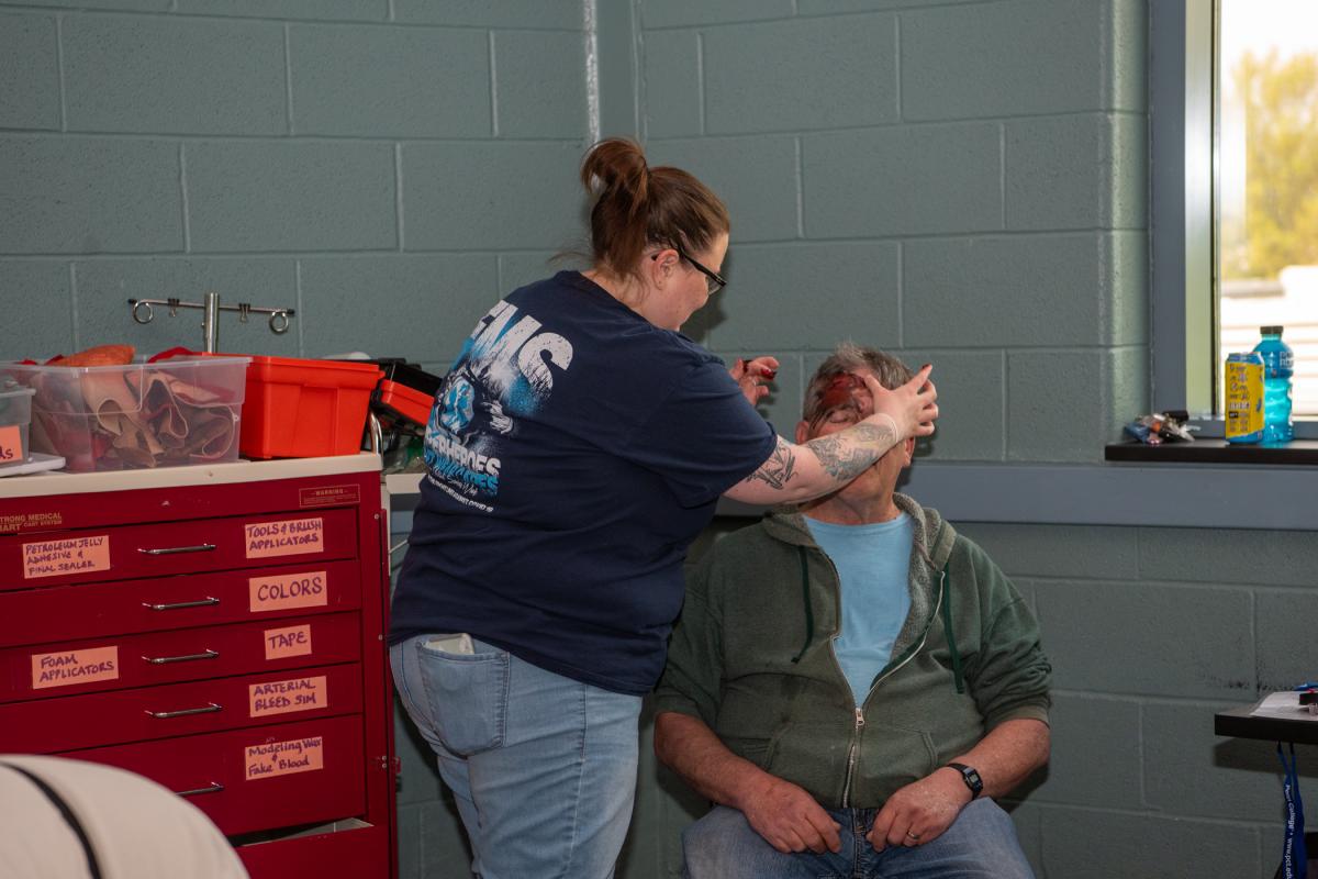 A Civil Air Patrol volunteer sits for his moulage session.