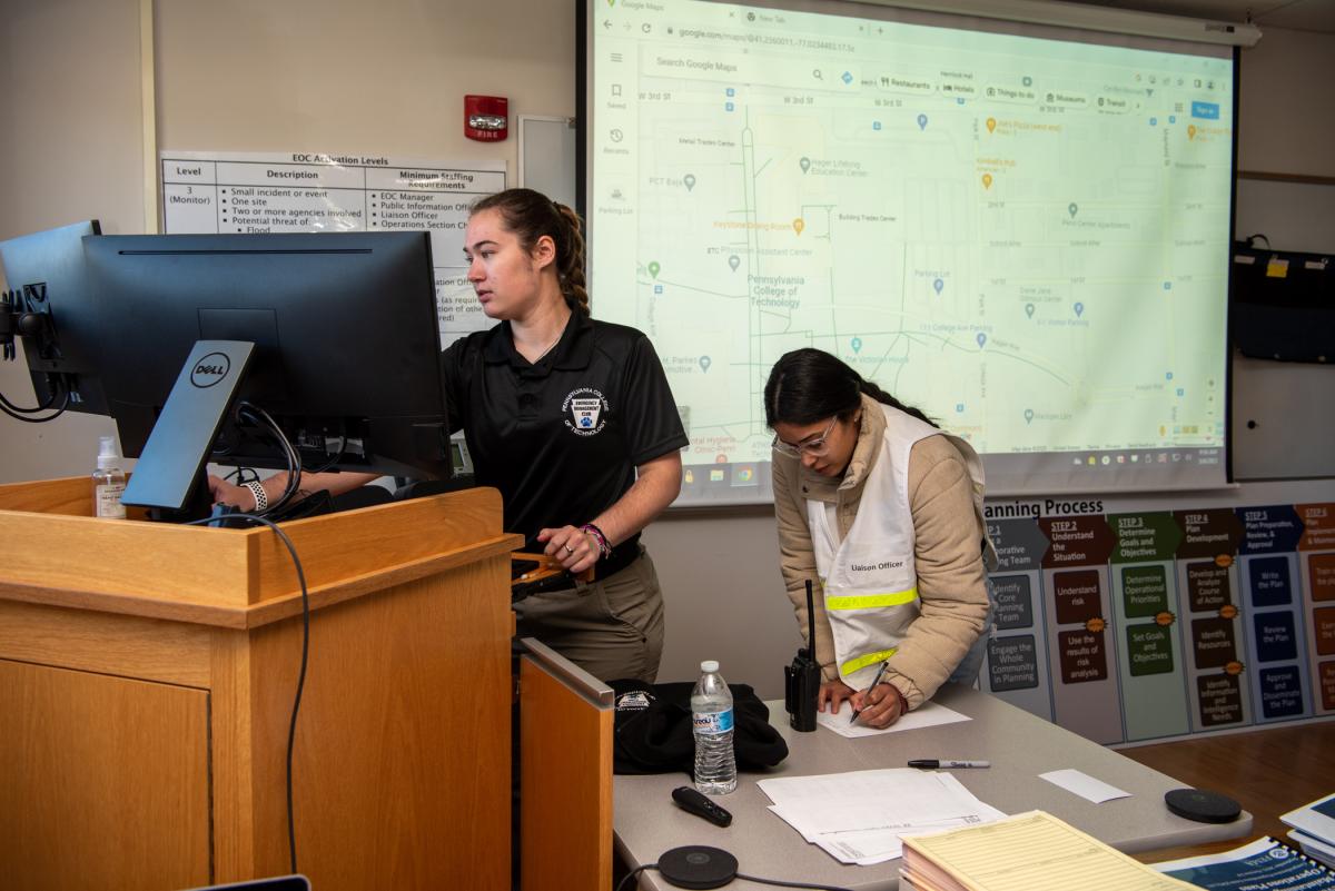 On the fourth floor of the ACC, Nicole R. Lichtinger (left) serves as EOC manager, and Joyce M. Fernandez Rivera is the liaison officer. Lichtinger is from Erie; Rivera is from York. 