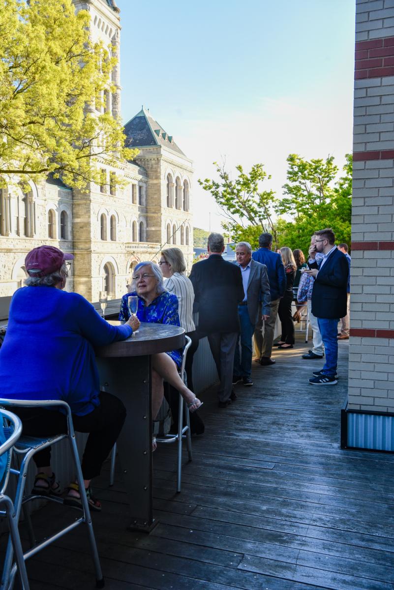 Guests enjoy the beautiful early May weather on the CAC balcony. 