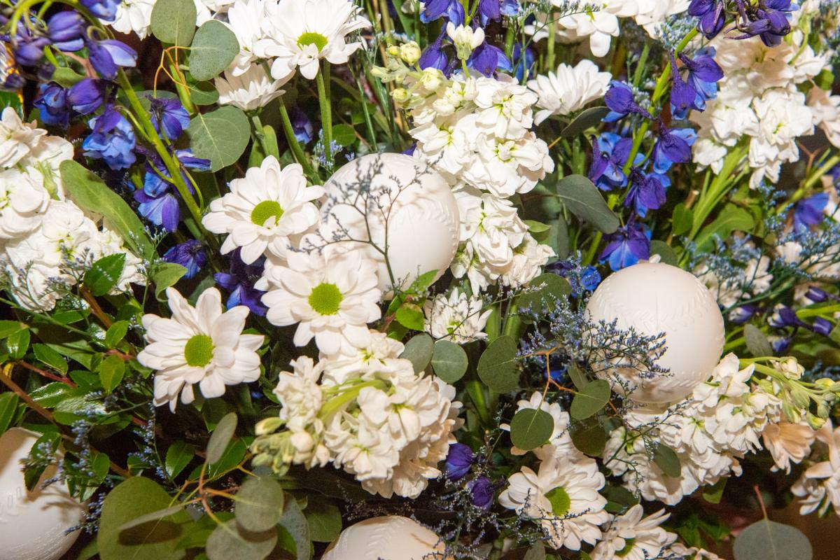 Well-played! Baseballs accent a bouquet at the base of the podium.