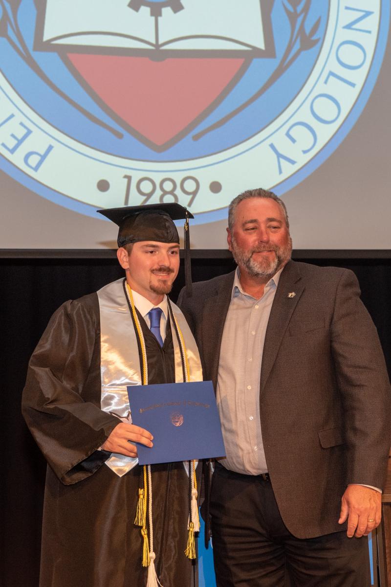 ... and Jacob R. Wagner joins his coach.