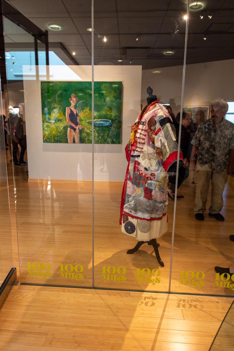 Through a glass lightly: a painting (on left) by Robert Sparrow Jones and mixed-media wearable art (on right) by Carol Ann Simon Cillo.
