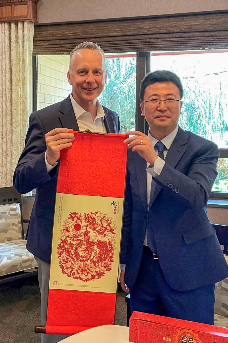 President Reed and Alp were each gifted a papercut fabric wall hanging featuring artwork that represents "a happy environment." (Photo provided by Alp.)