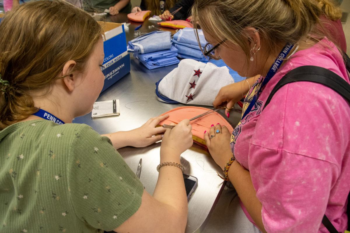 In the Surgical Technology Lab, Health Careers explorers learn to suture.