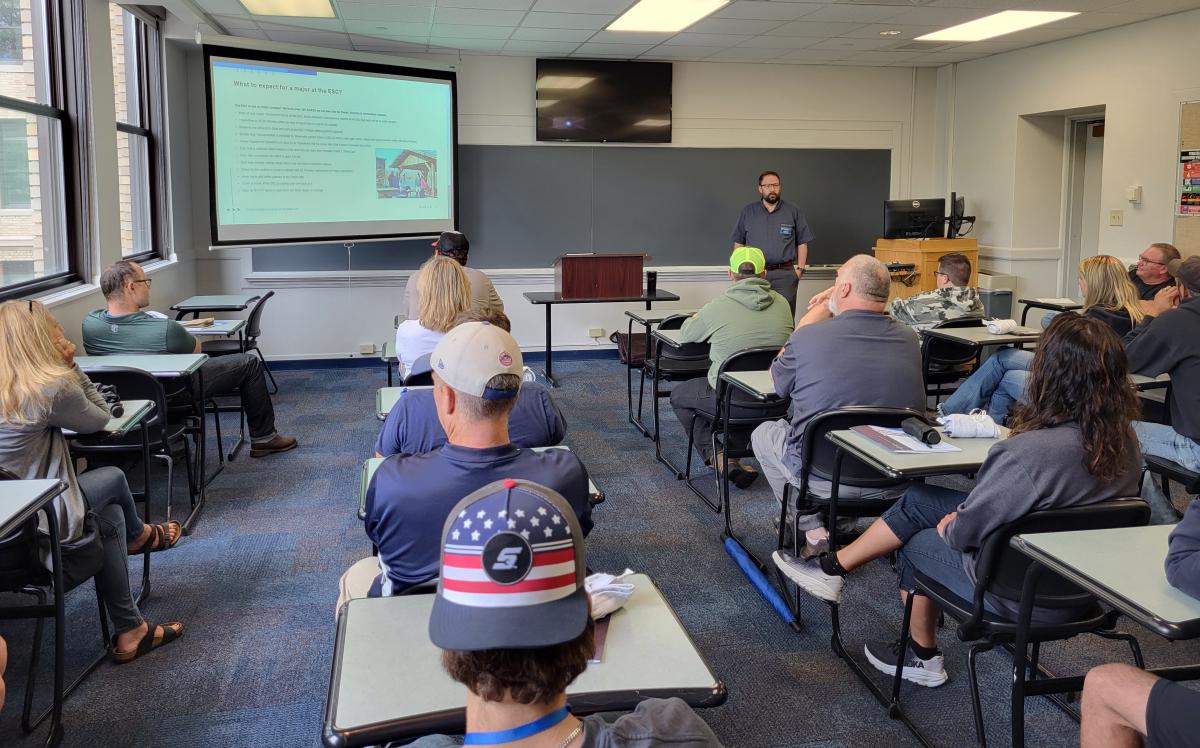 Justin W. Beishline, assistant dean of diesel technology and natural resources, introduces guests to the Schneebeli Earth Science Center that lies about a dozen miles south of main campus. At far right is Carl J. Bower Jr., assistant professor and department head for horticulture, who was among the ESC faculty members taking part in the day's presentations.