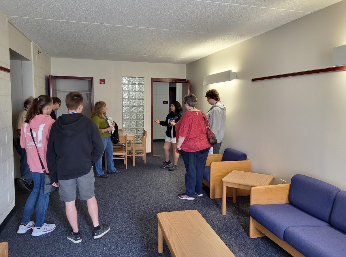 The afternoon included tours of the college's different on-campus housing styles, this one led by Ashley M. Hunter, coordinator of residence life operations.