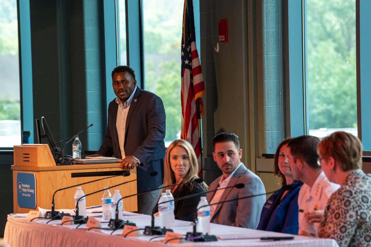 Woods moderates the discussion, posing questions to the panel members. Seated (from left) are Tara Loew, director of the Apprenticeship and Training Office for the Pennsylvania Department of Labor & Industry; Nick Burdick, Region 2 multi-state navigator for the U.S.Department of Labor's Office of Apprenticeship; Diehl; Tony Bixby, chief of Susquehanna Regional Emergency Medical Services/UPMC; and Munro.
