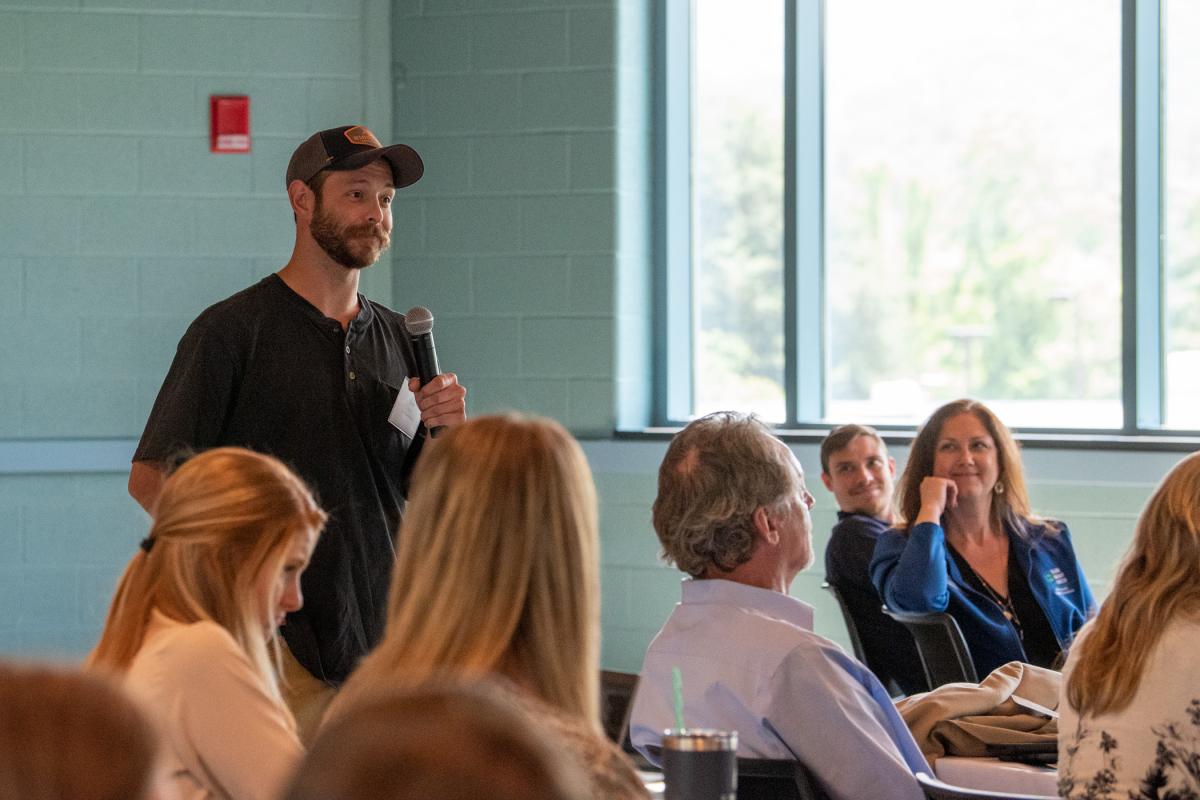 Tyler G. Smith, a West Pharmaceutical Services’ employee who has benefited from apprenticeships, engages the audience.
