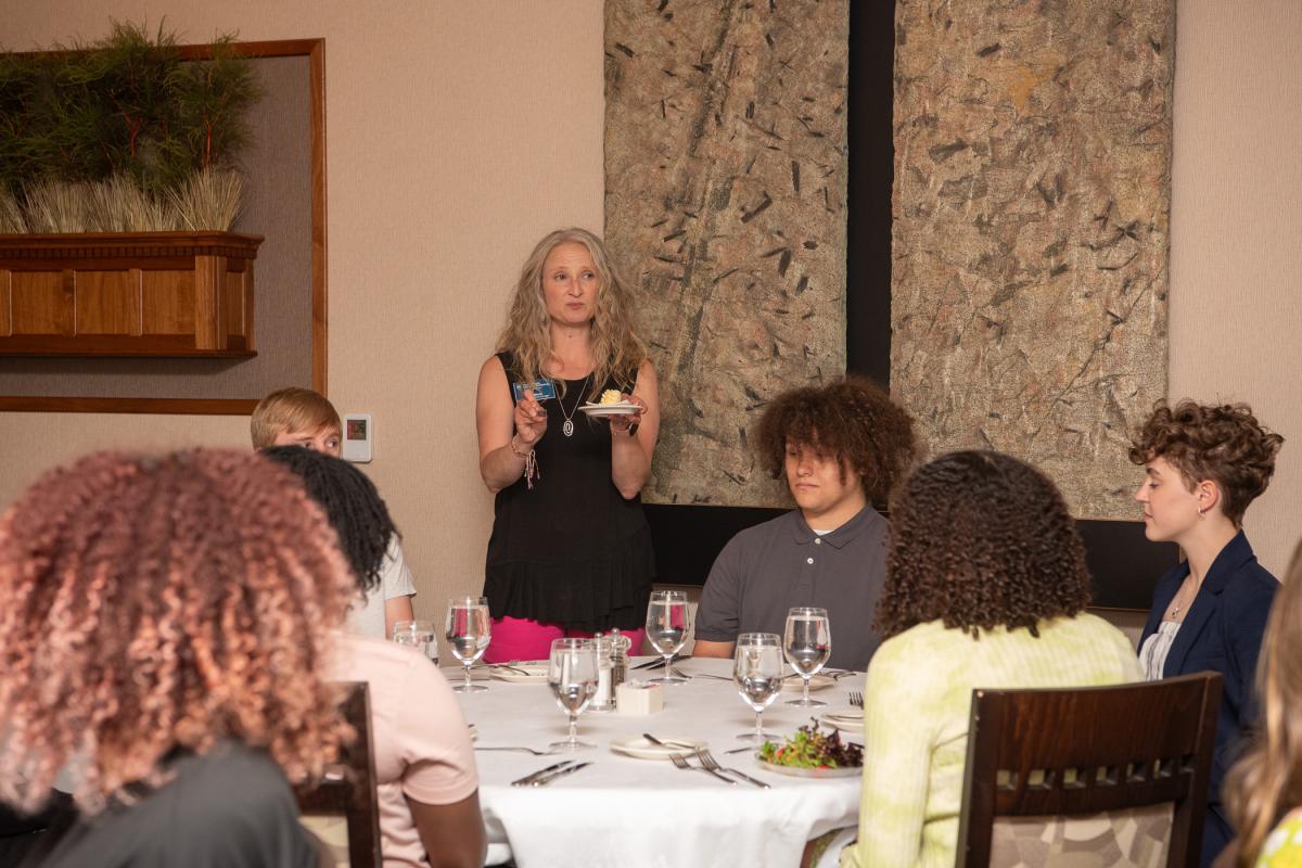 Erin S. Shultz, college relations manager, advises Architecture Odyssey students on proper butter protocol ... 