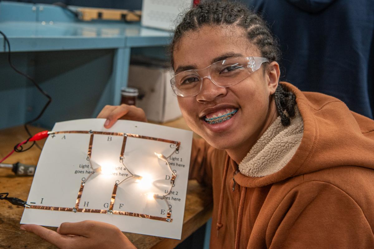A student proudly displays his finished circuit. In addition to lab-focused workshops, campers enjoyed a trip to the Piper Aviation Museum and William T. Piper Memorial Airport in Lock Haven, where the 37th annual Sentimental Journey Fly-In was being held through Saturday. 