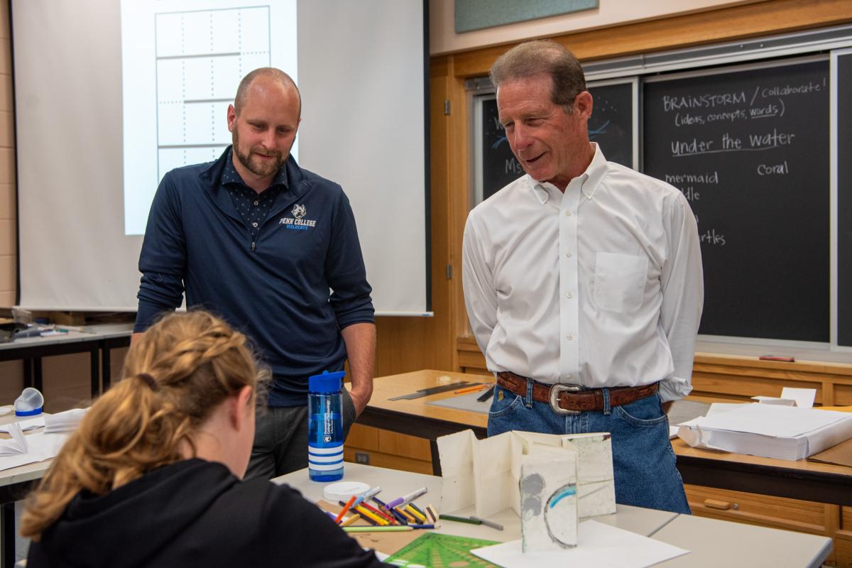 Blair D. Soars (right), president of Pneu-Dart Inc. and My Tomorrow sponsor, enjoys visiting youngsters with Kyle A. Smith, senior executive director of college relations.