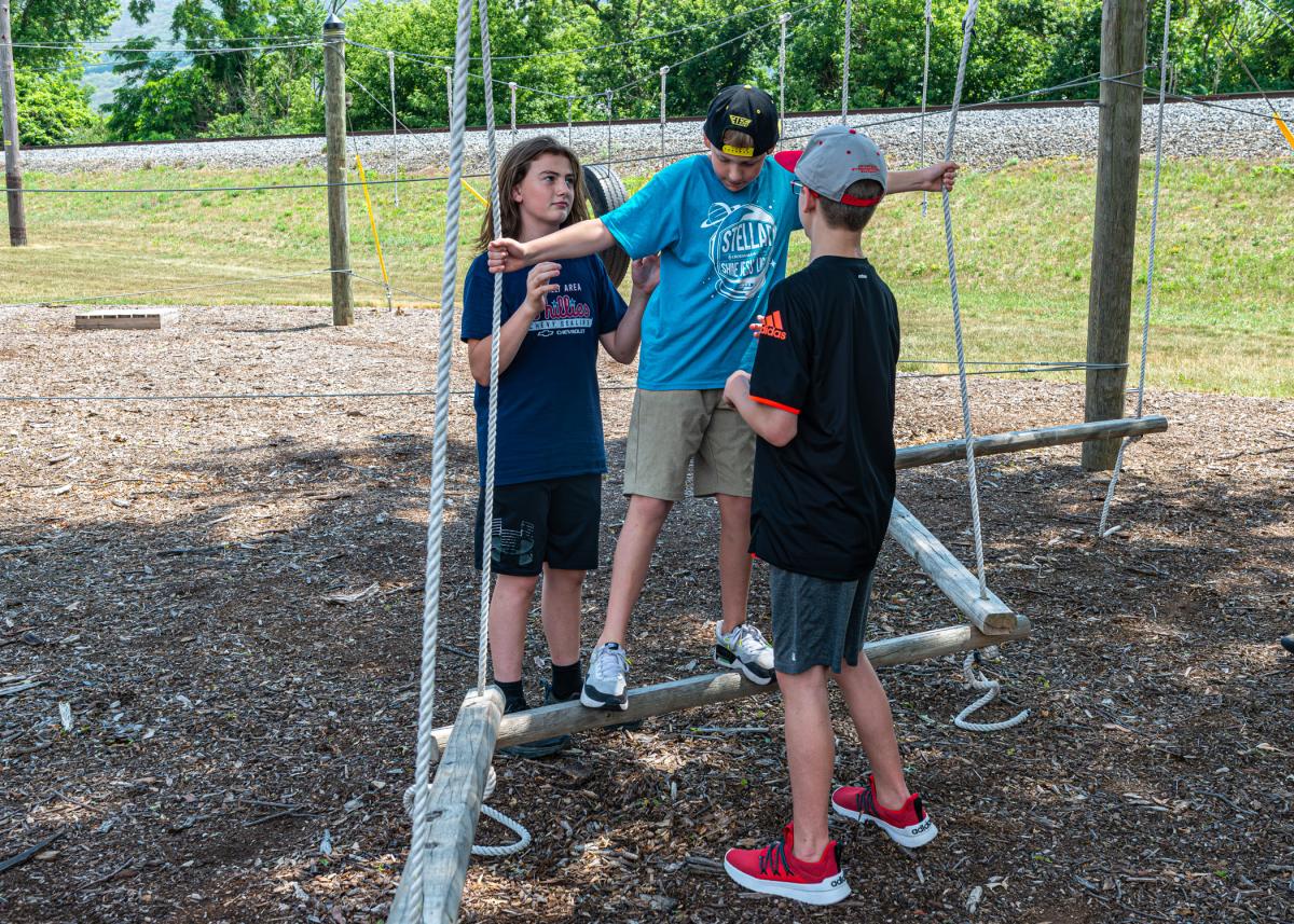 Starting their week on the Fish Real Estate Leadership Challenge Course, My Tomorrow participants quickly embrace the campus resource's ethos of teamwork.