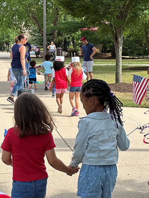 Hand-in-hand, the parade marches on