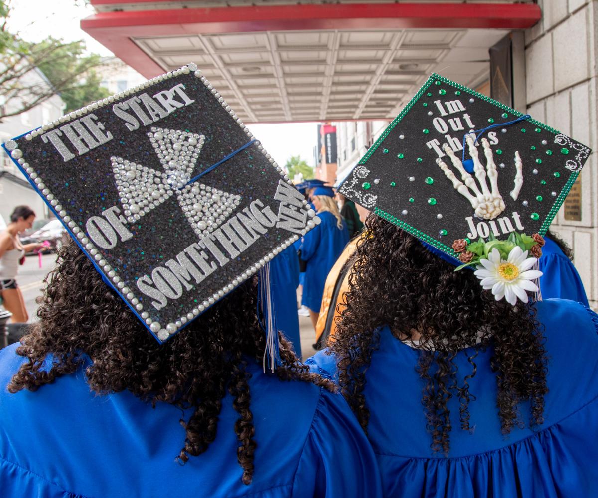 Twins Erin R. and Sofie A. Dean sport equally creative caps. The radiography graduates are from Harrisburg.