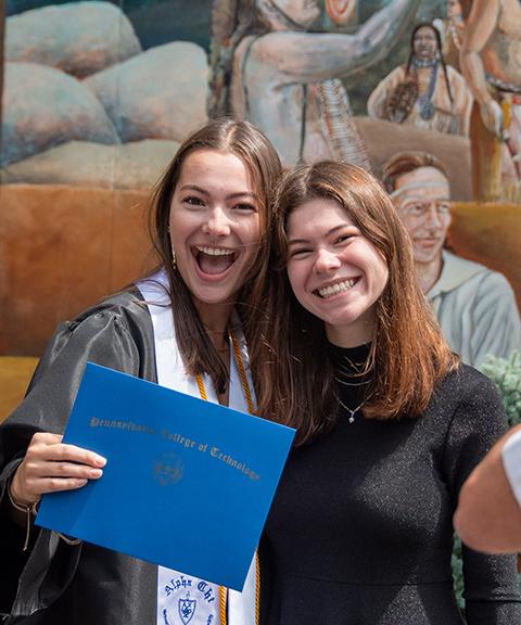 Dental hygiene grad Sarah C. Bennett, of Farmington, N.Y., shows off her hard-earned credential.