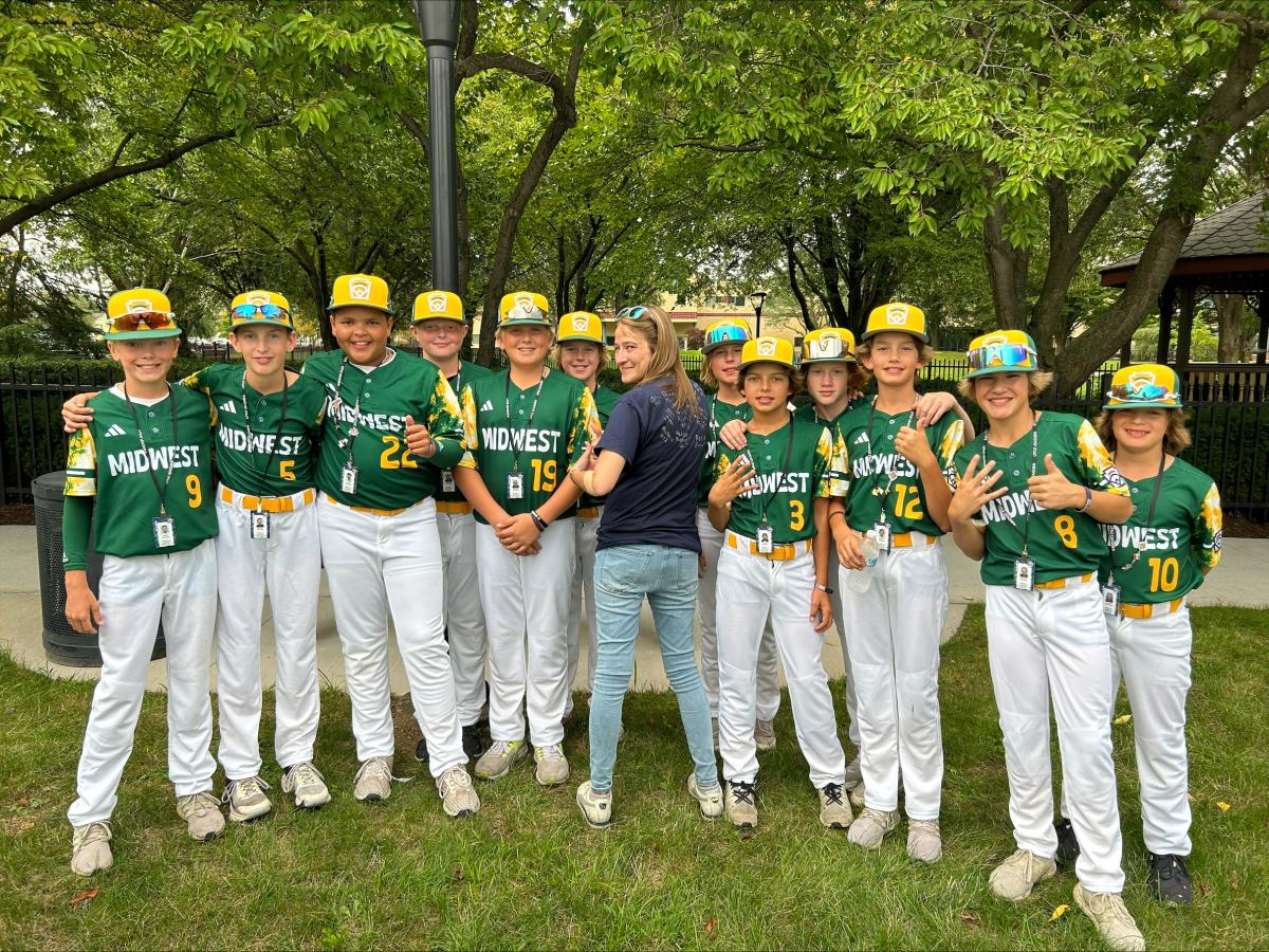 Picnic volunteer Krista E. Snyder, admissions counselor for transfer and adult students, shared her photo with the Midwest Region players. "They are the first team ever to make it from North Dakota," she said, "so I had them all sign my shirt and told them, when they won/became famous, I would have this shirt to remember them by." 