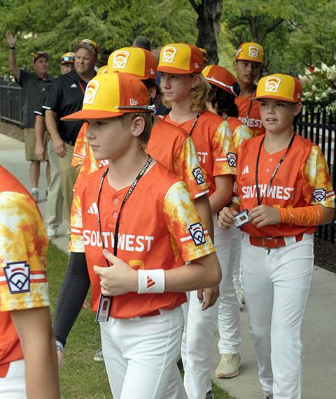 This year's Southwest entry (from Needville, Texas) rounds the corner from The Victorian House to the food tent.