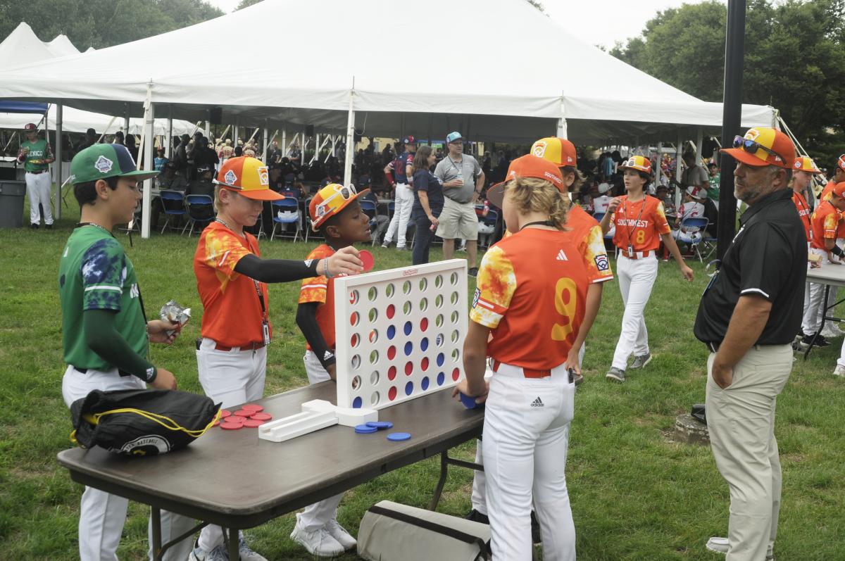 The Southwest and Mexico engage in some off-field competition, playing Connect 4 during a pre-parade lull.