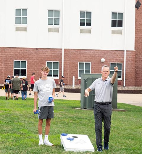 President Michael J. Reed puts just the right amount of loft into his toss.