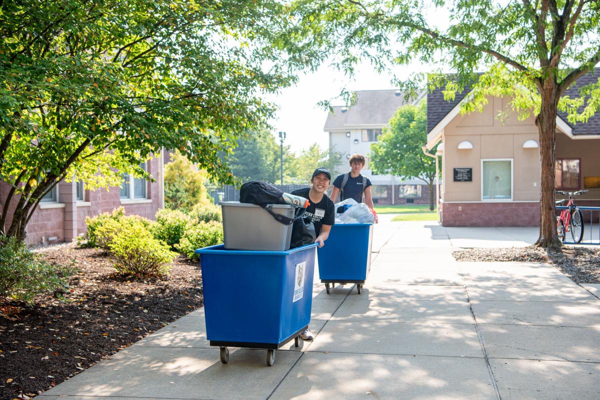Cierra D. Miller provides some move-in muscle, assisting Jaden C. Adamczyk (in background), building construction technology, of Reading. A Wildcat soccer player, Miller hails from Dover and is enrolled in welding & fabrication engineering technology.