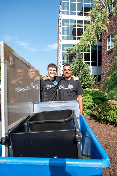 Resident Assistant Aidan J. Weissenberger (left) and Han A. Gandarillas-Reyes, residence desk clerk, share a happy moment in between blue-bin duties. Weissenberger, of Hightstown, N.J., is enrolled in architecture & sustainable design. Gandarillas-Reyes, of East Norriton, is in landscape/plant production technology.