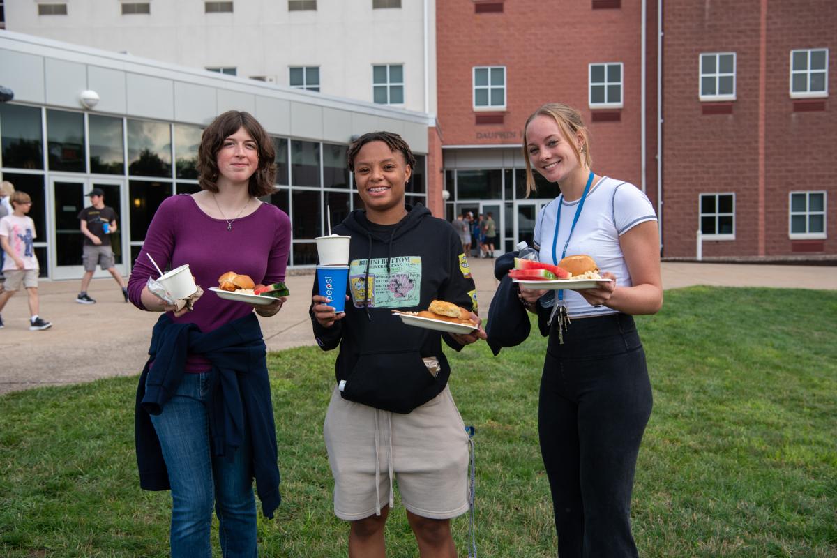 A well-balanced meal ... literally! This talented trio leaves Capitol Eatery en route to dining under the tent.