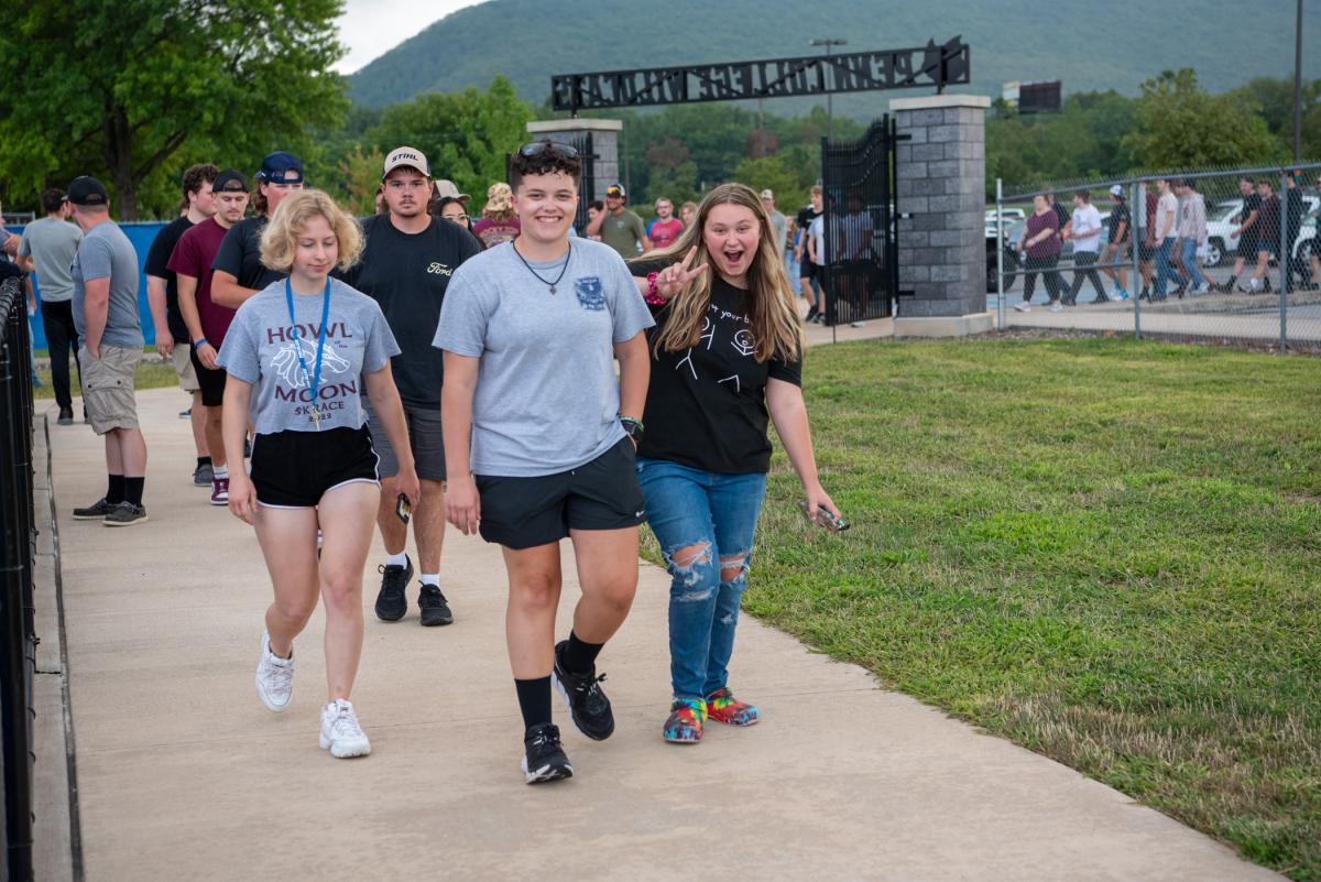 Students march into UPMC Field ...