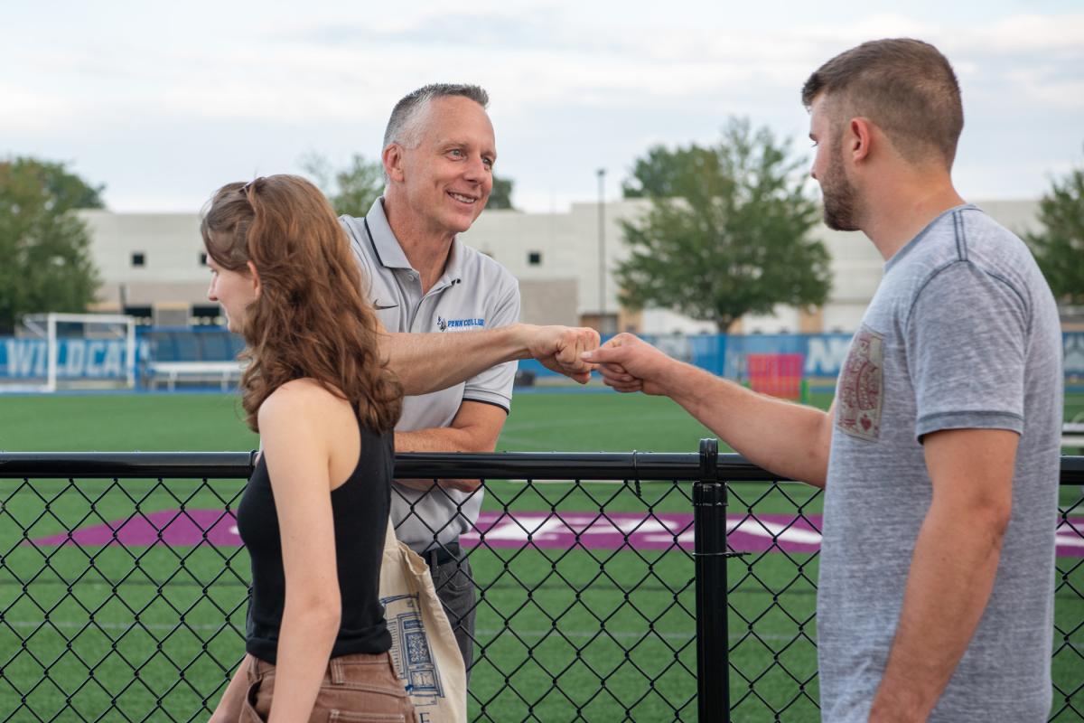... with a friendly fist-bump that solidly says, "Welcome to Penn College!"