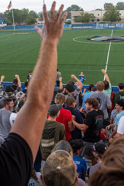 Hands in the air! Rain? We don’t care! There're freebies to be caught, lobbed into the stands by RA Kianna Antonia Rizzo.