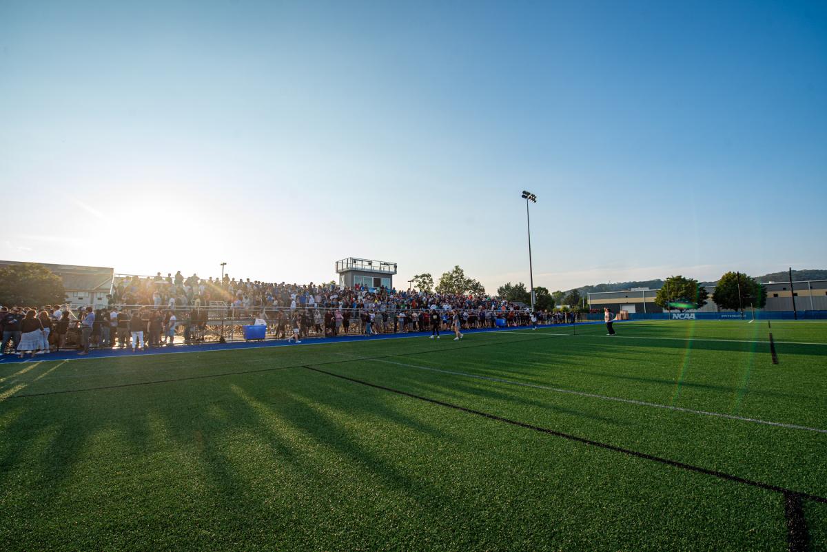 The sinking sun casts lengthening shadows over convocation. 