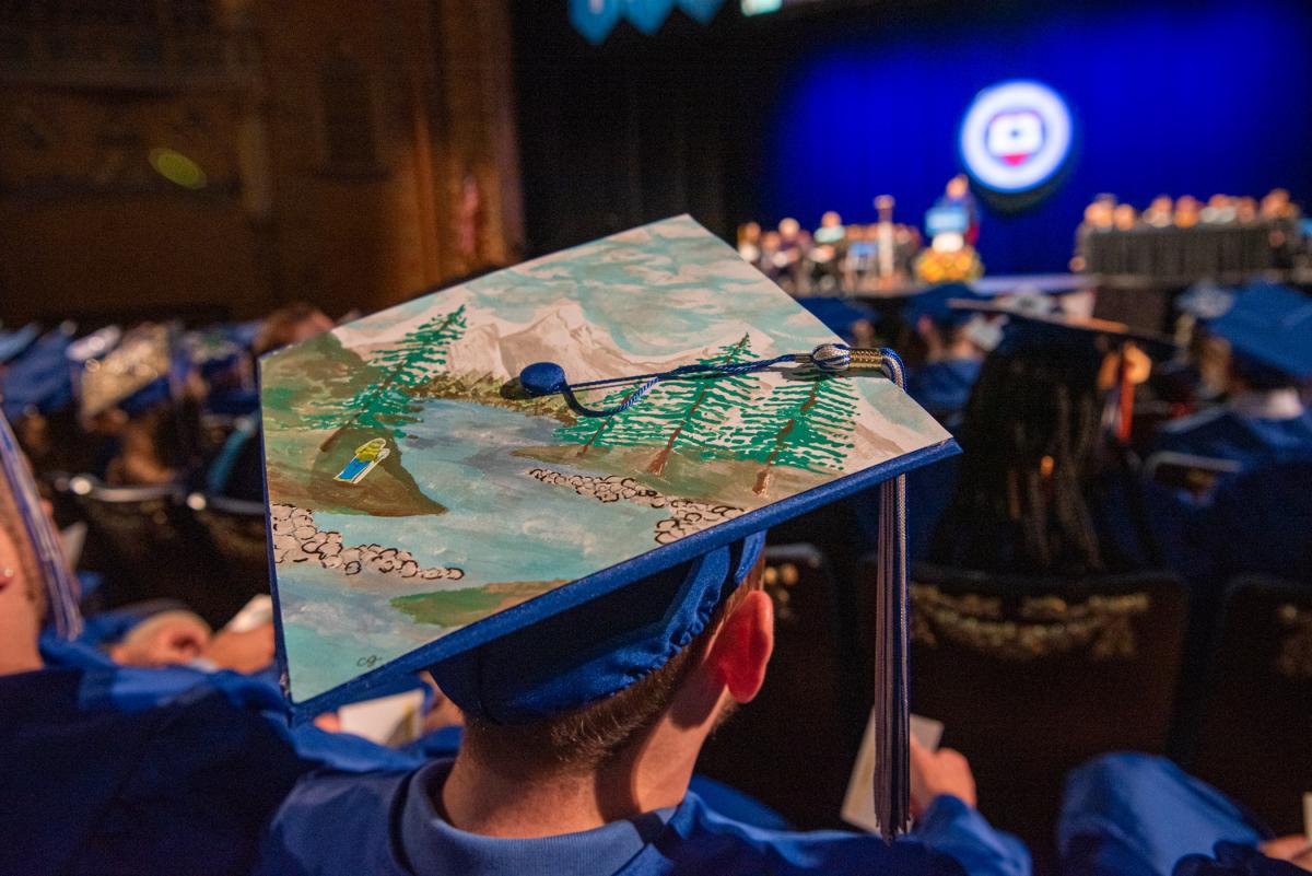 The great outdoors beckons from this grad’s cap.