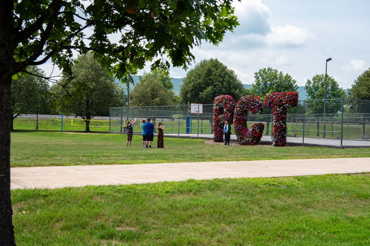 Grads gravitate back to campus to capture more photo-worthy moments ... 