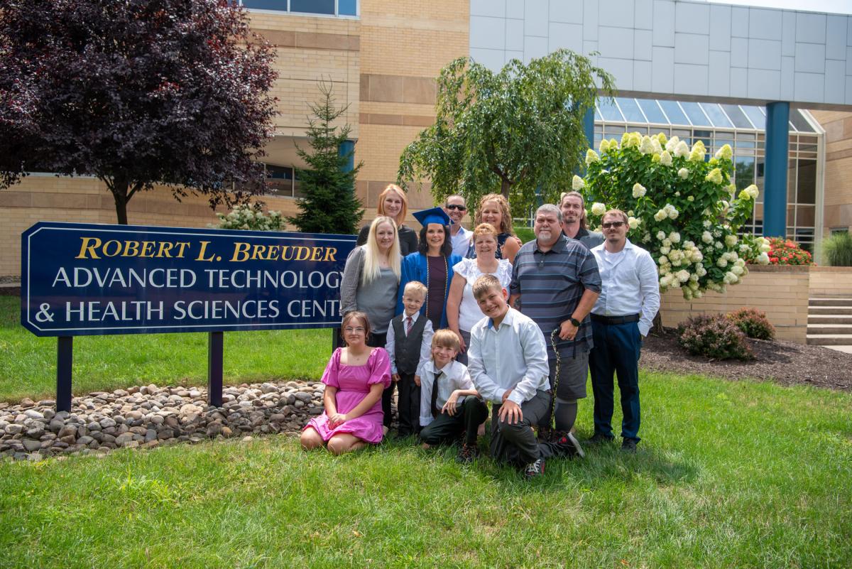 Radiography graduate Kelsey Jo Kronenwetter and her cooperative crew gather for a group photo at the building where she spent a great deal of time.