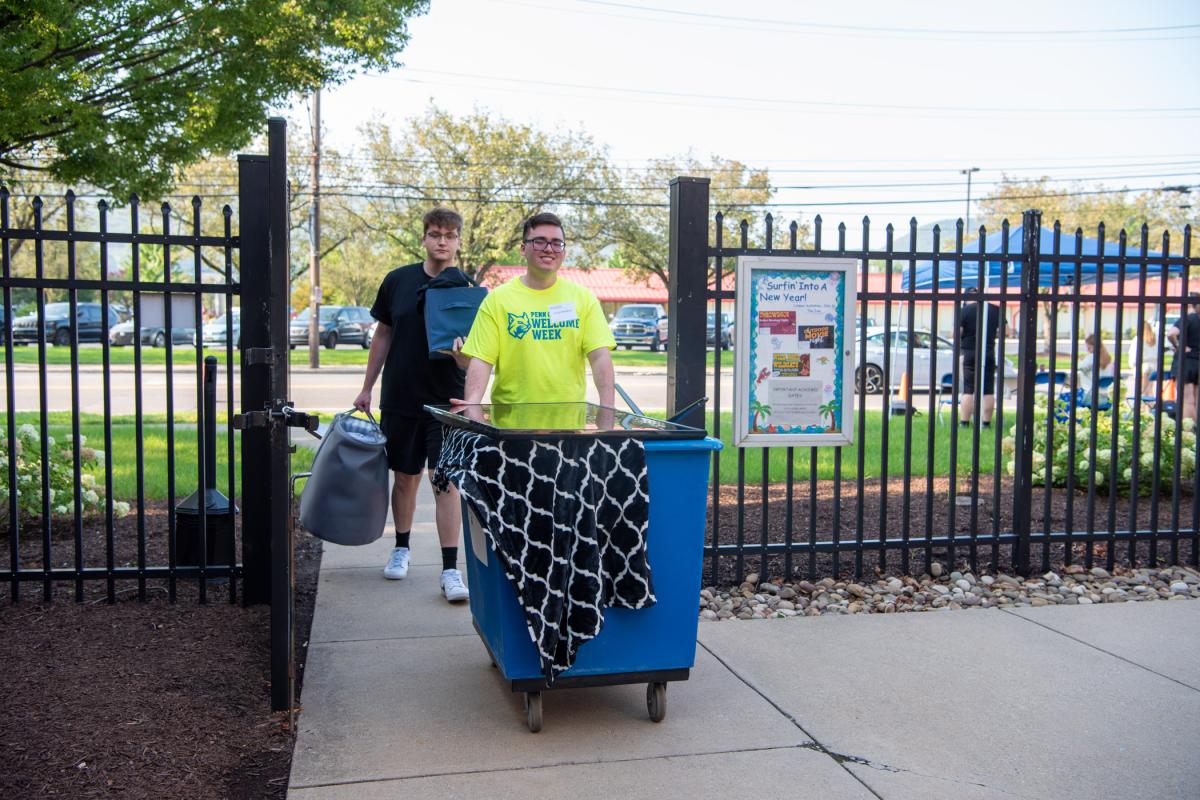 Surfin’ into a new year! Move-in volunteer Daniel L. Medford (in yellow shirt), a paramedic science student, offers an assist to Patrick R. Conan, a new transfer student enrolled in electronics & computer engineering technology. Coincidentally, both are from York. Side note: Residence halls are so full, 80 freshmen are moving into The Village and 40 into Campus View (both of which normally house upper-level students).