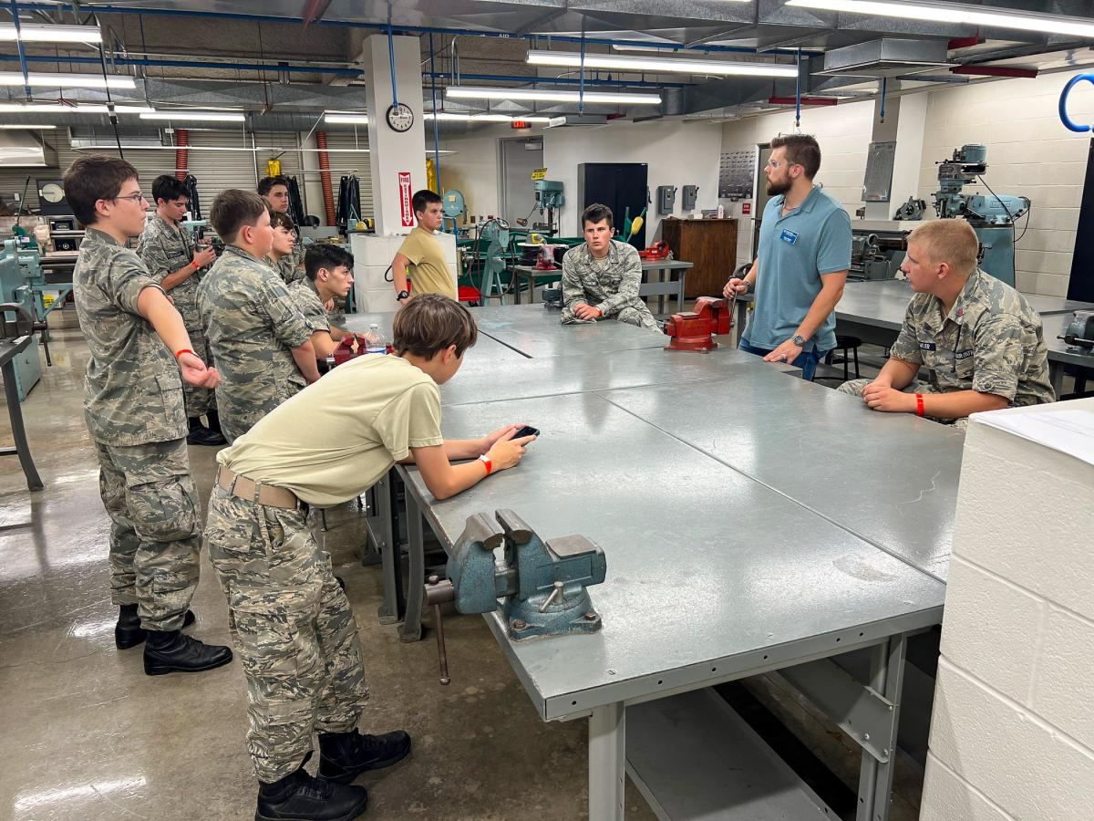 At the college’s Lumley Aviation Center, Keyser leads a group in a discussion on aerospace mechanics.