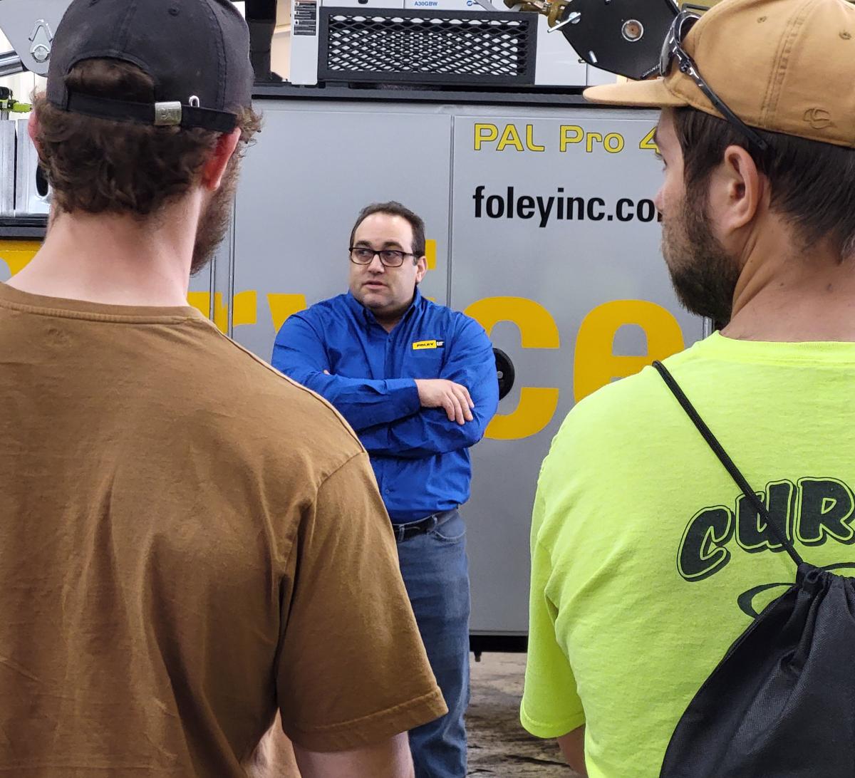  Alumnus Louis DiDonato ('00, heavy construction equipment technology: Caterpillar emphasis) dialogues with students in his role as a technical communicator for Foley.