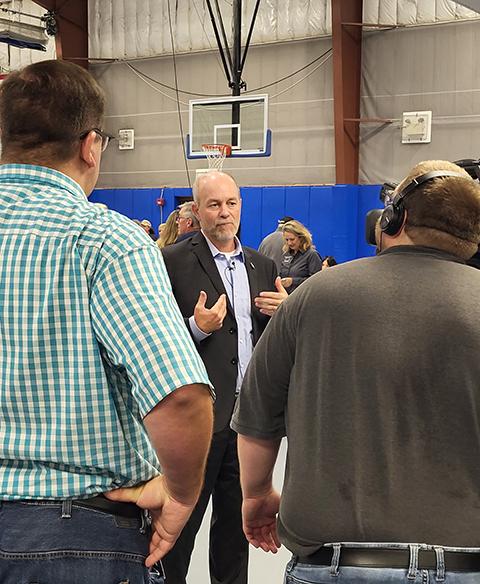 Flick, whose territory comprises parts of Lycoming and Union counties, tapes a Human Services Expo invitation for online posting. Visible over Flick's left shoulder is Alivia Tagliaferri, who manages the legislator's district office and was instrumental in planning the day.