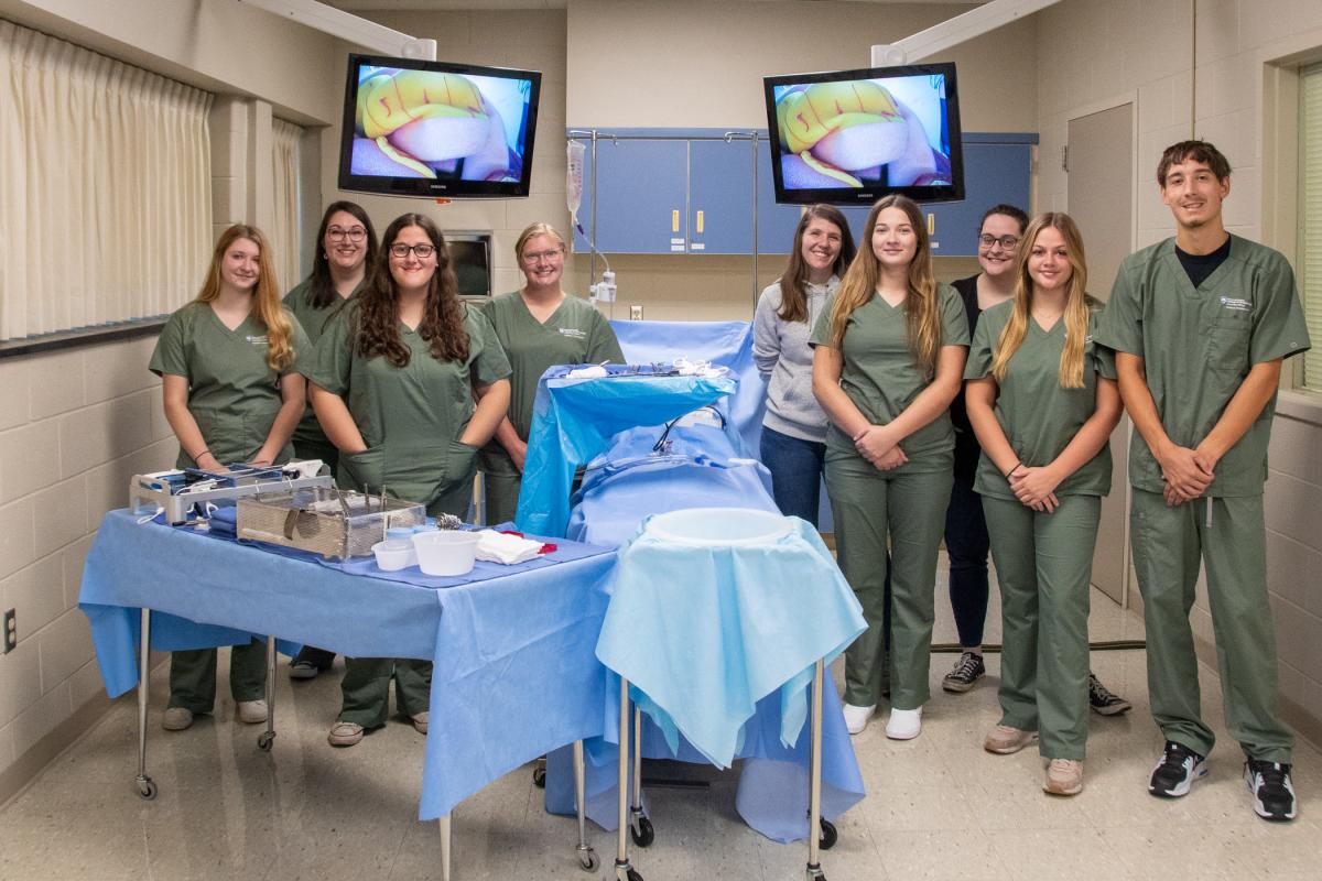 Students in Pennsylvania College of Technology’s surgical technology major gather in front of a surgical demonstration area to celebrate National Surgical Technologists Week, commemorated nationally by the Association of Surgical Technologists the week of Sept. 17-23. The facilities also include a surgical suite where students scrub and practice their skill in an operating room environment. 