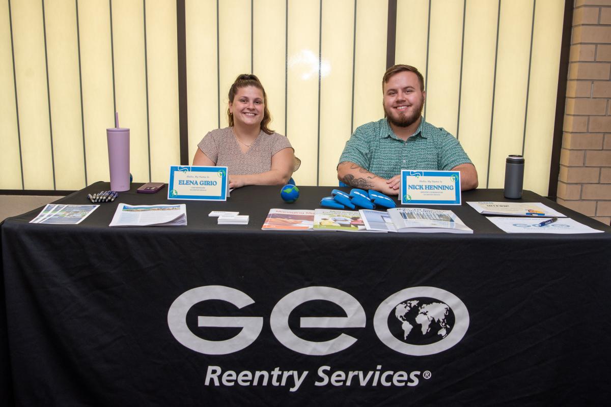 Ready to recruit! Human services alumni and GEO Reentry Services staff Elena L. Girio (left), case manager, and Nick W. Henning, reentry coordinator, are poised to advise job seekers.