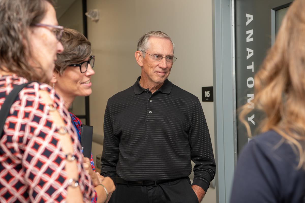 John M. Confer, a member of the Penn College Foundation Board of Directors, enjoys listening to students’ career enthusiasm.