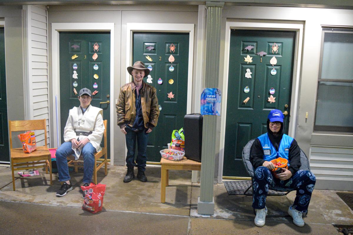 Friendly Village residents welcome trick-or-treaters with smiles and more.