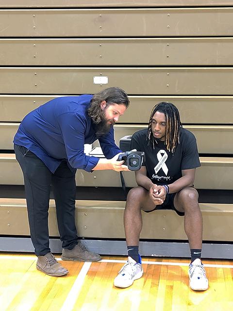  Mantione goes over the screening results with student-athlete Ronn Flood Jr., of Union, N.J., majoring in business administration. 