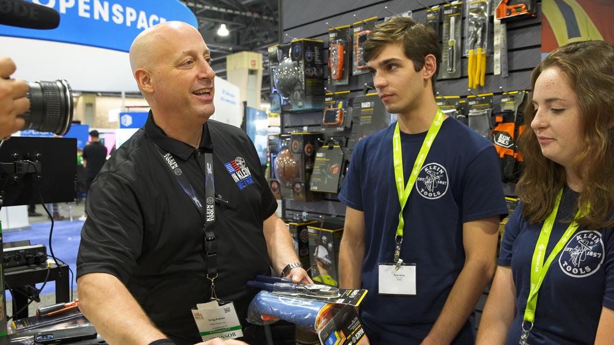 Greg Palese (left), vice president of marketing for Klein Tools, interacts with Penn College students Ryan Nicita, of Hillsdale, N.J., and Lisa C. Prenatt, of Meadville.