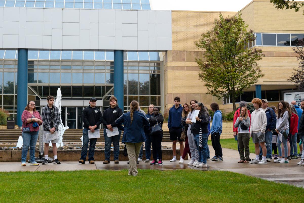 Presidential Ambassador Morgan T. Bartholomew, among those who regularly share their student experience and perspective, enthralls a crowd outside the Breuder Advanced Technology & Health Sciences Center. Bartholomew spends a great deal of time in that building, as her chosen polymer engineering program is housed in the first floor's east wing.